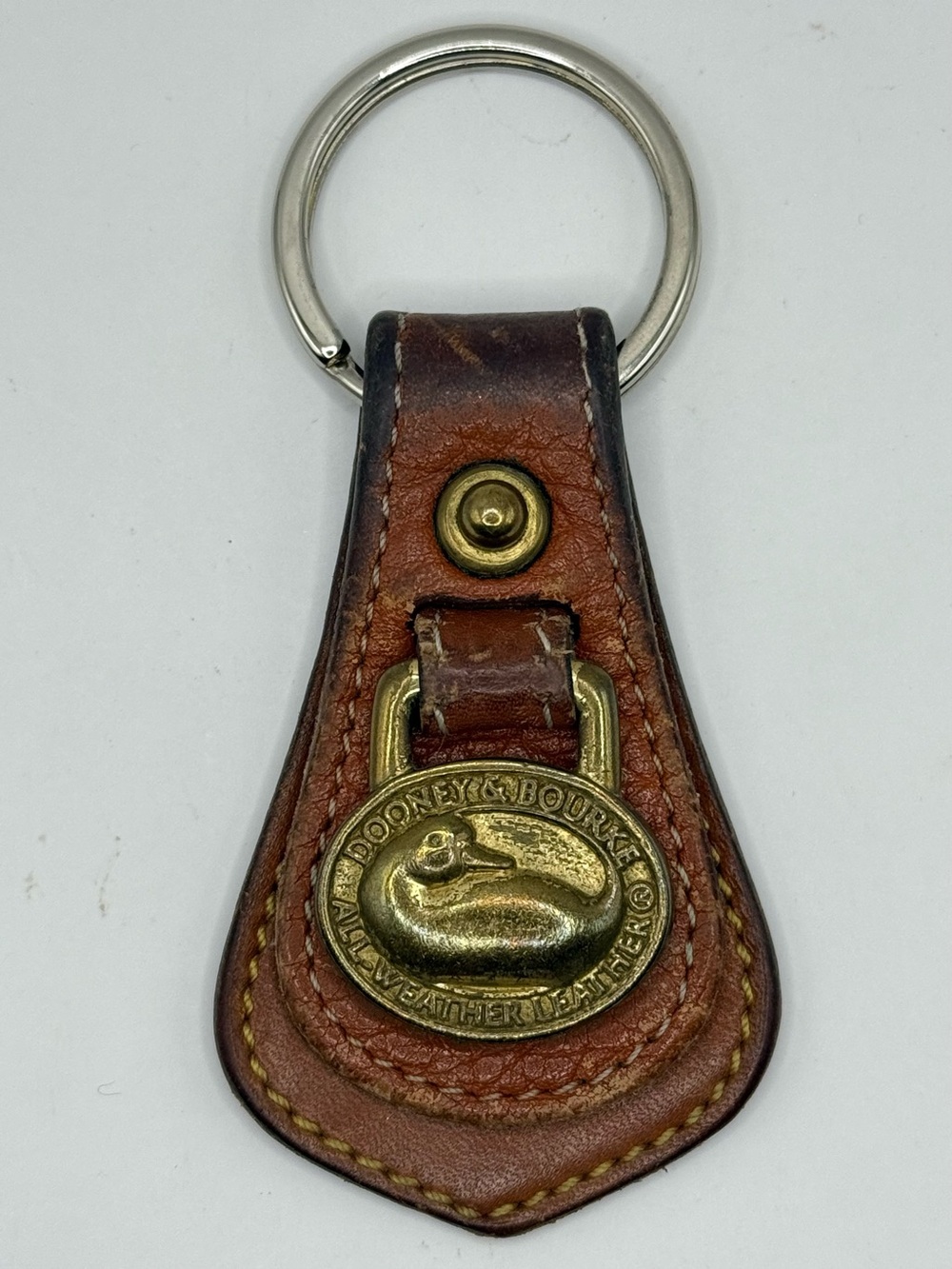 Dooney & Bourke All Weather Leather and Brass Duck Keychain Fob